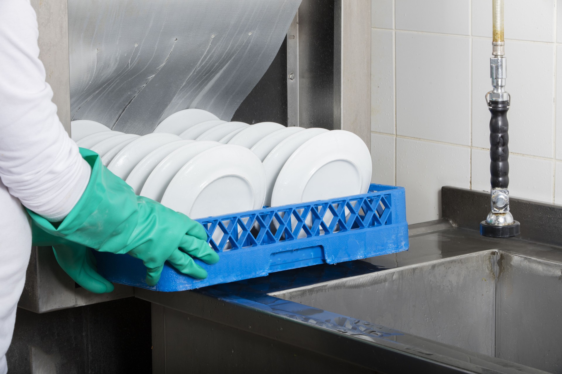 Shot of a large industrial kitchen dishwasher and sink