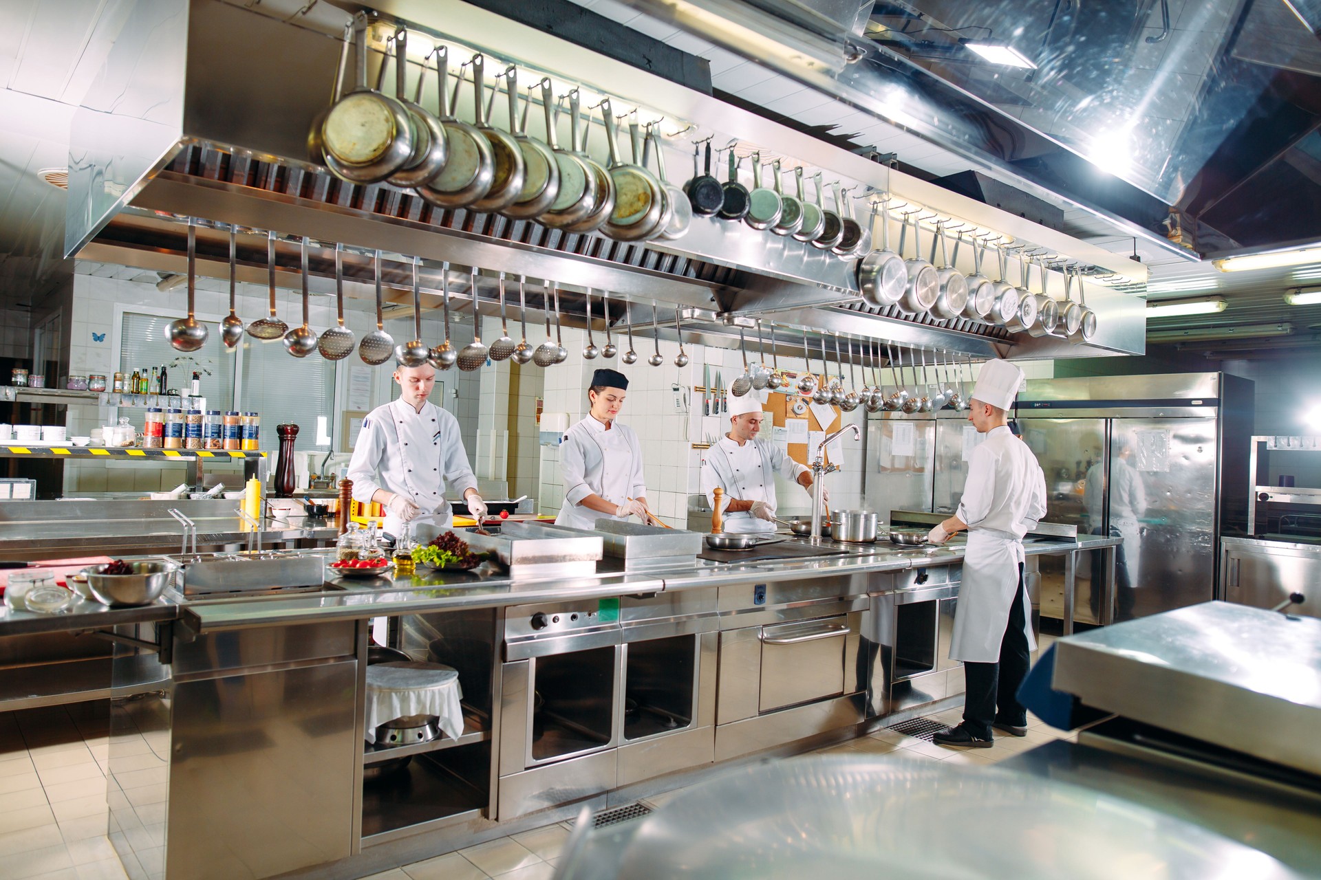 Modern kitchen. The chefs prepare meals in the restaurant's kitchen
